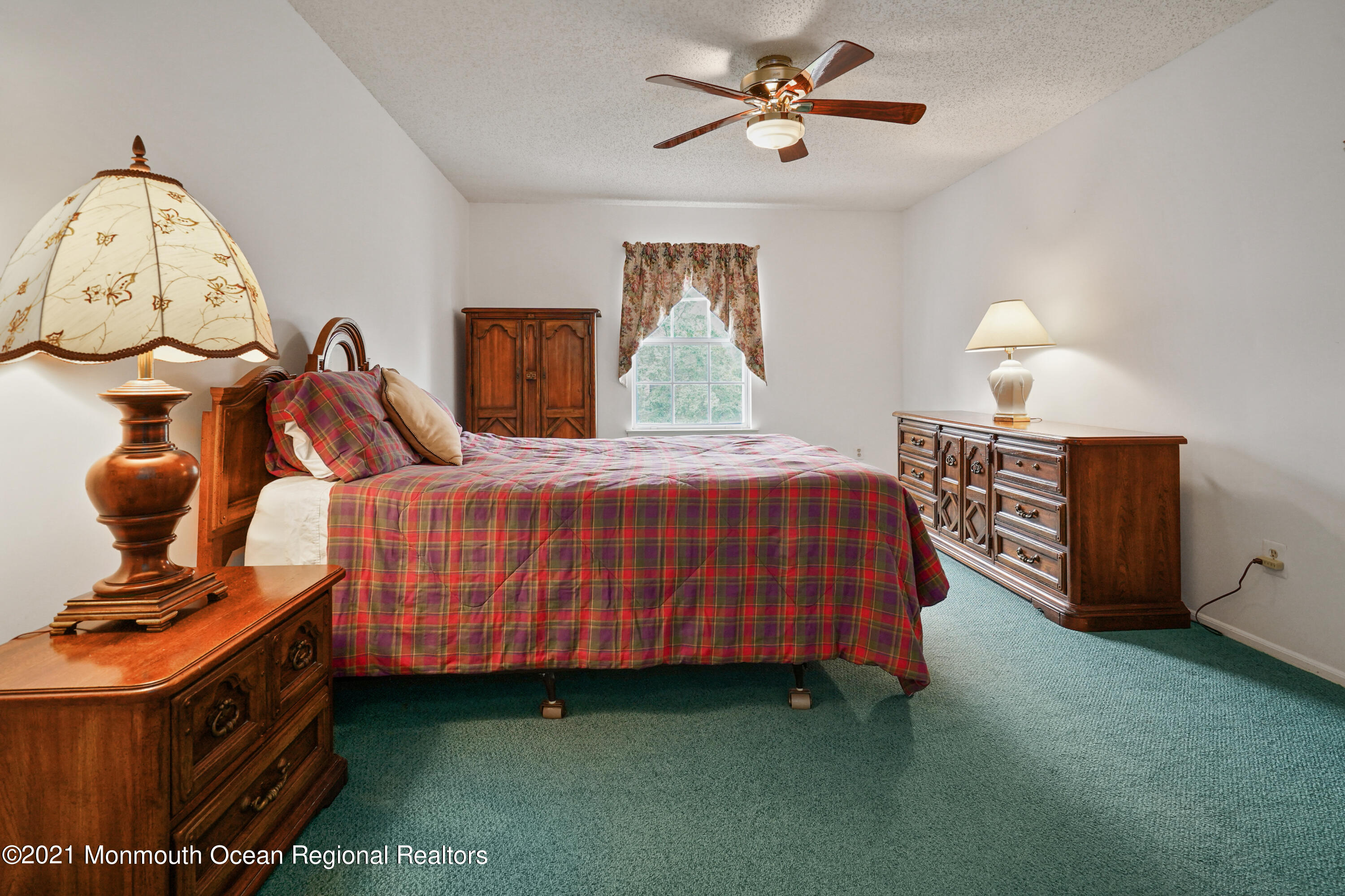 44 Racquet Road Wall, NJ 07719 - Photo 8 of 21 a bedroom with a bed and a chandelier