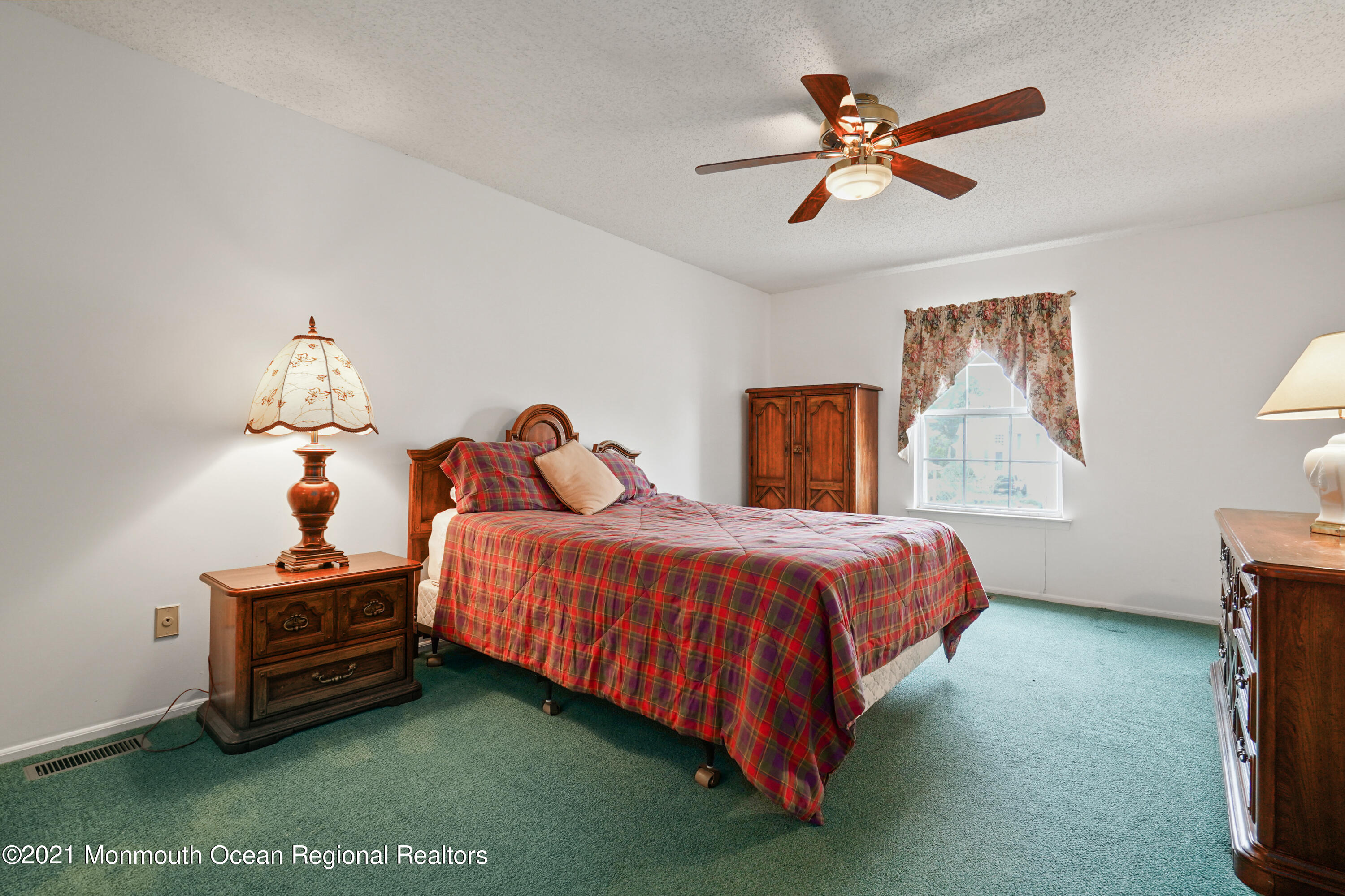 44 Racquet Road Wall, NJ 07719 - Photo 9 of 21 a bedroom with a bed and a chandelier
