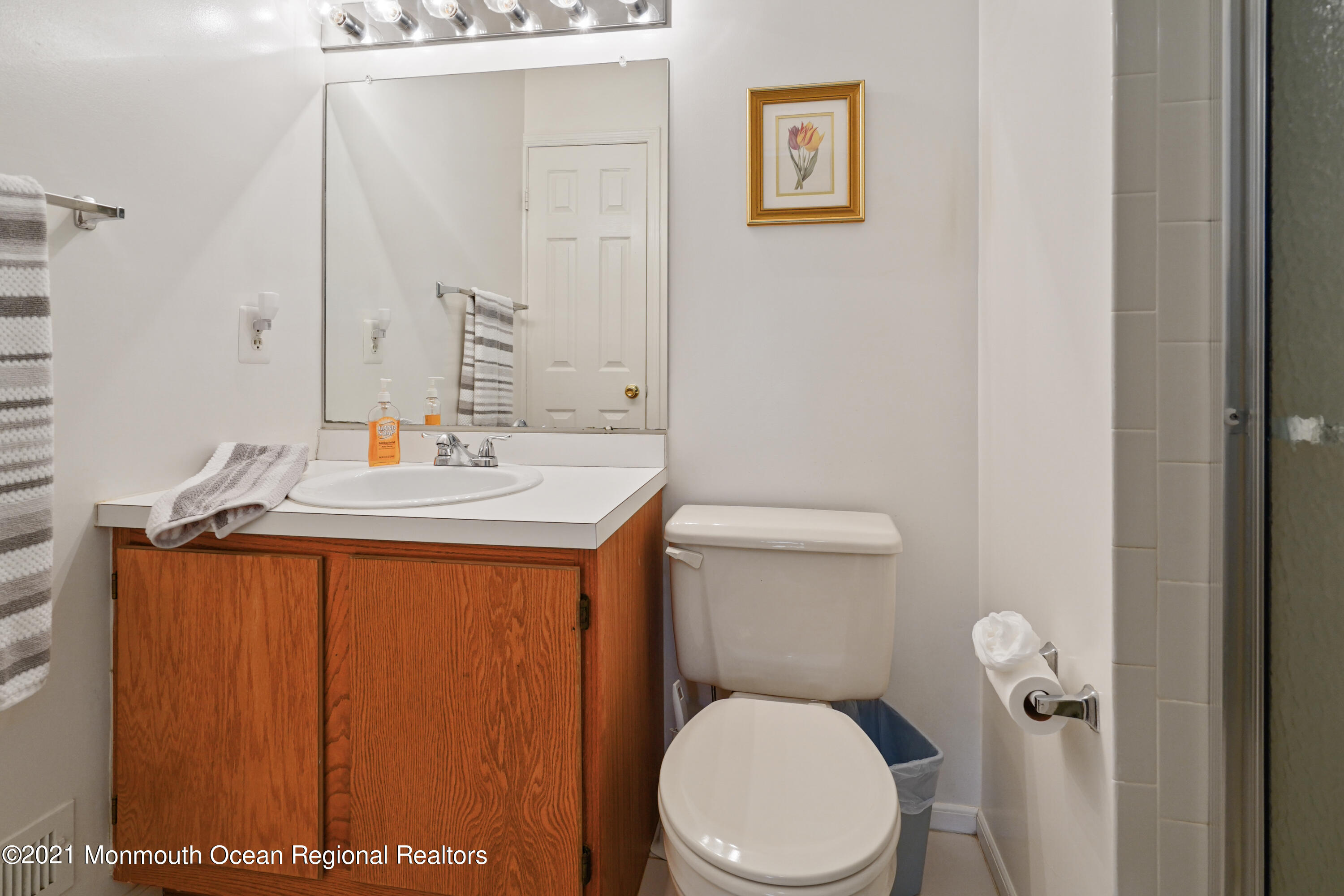 44 Racquet Road Wall, NJ 07719 - Photo 10 of 21 a bathroom with a sink a toilet and mirror