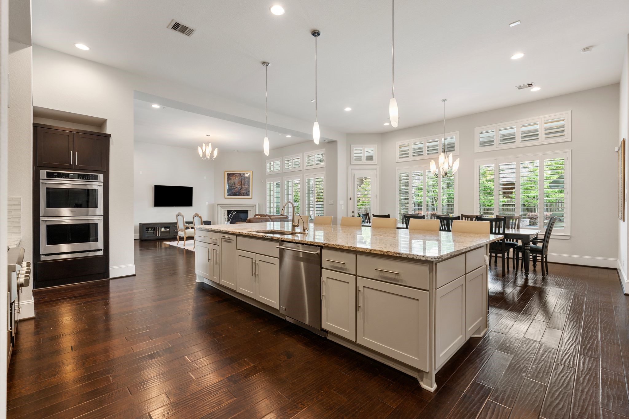 2926 Fairmont Ridge Lane Katy, TX 77494 - Photo 22 of 49 a large white kitchen with a large window and stainless steel appliances