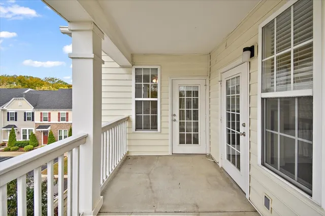 a view of balcony with furniture