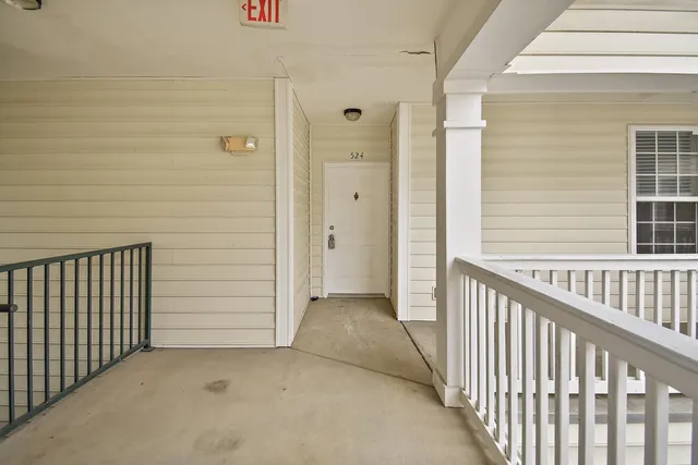 a view of a porch with wooden floor