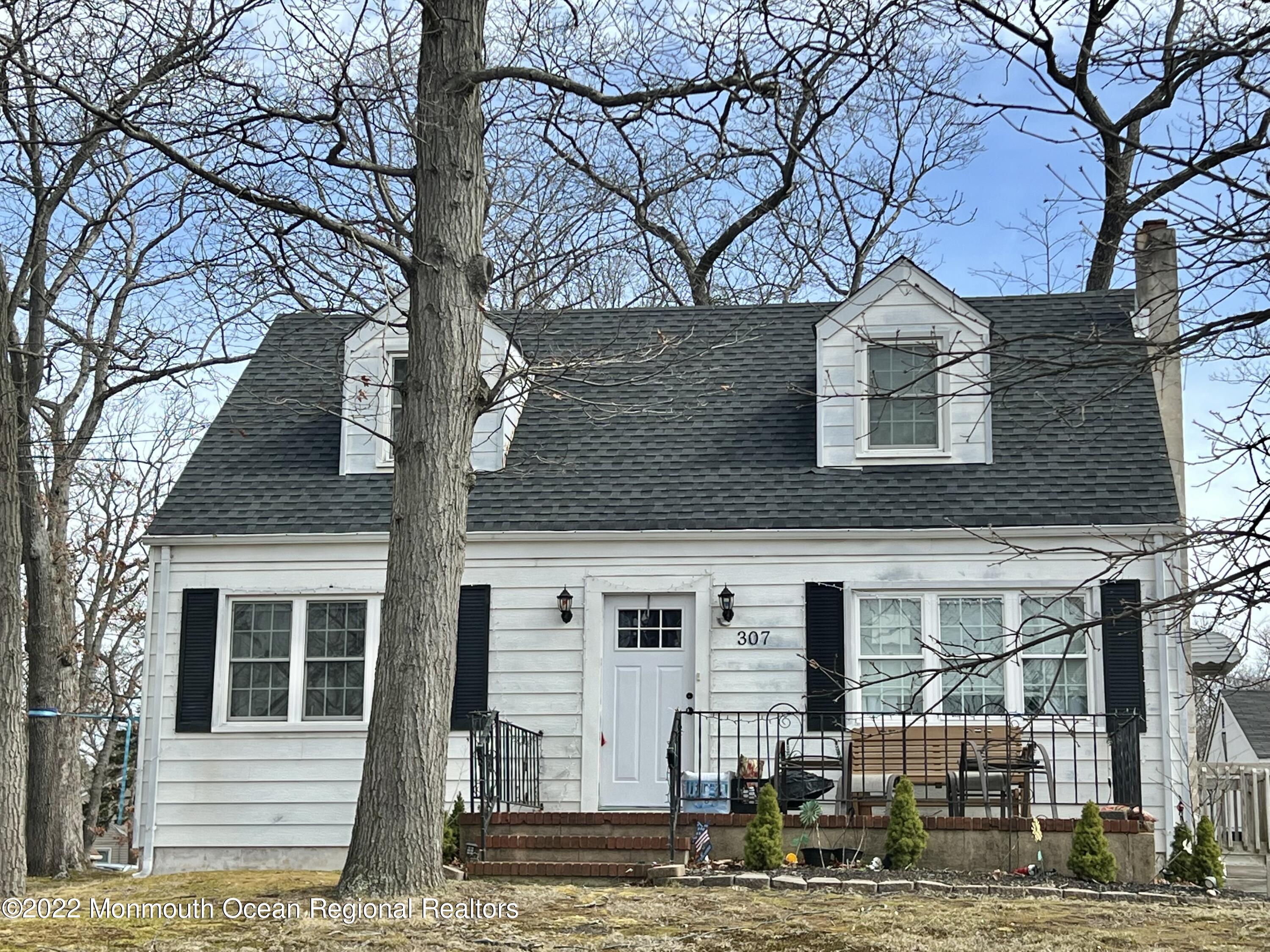 307 Herbertsville Road Brick, NJ 08724 - Photo 1 of 10 a front view of a house with large trees