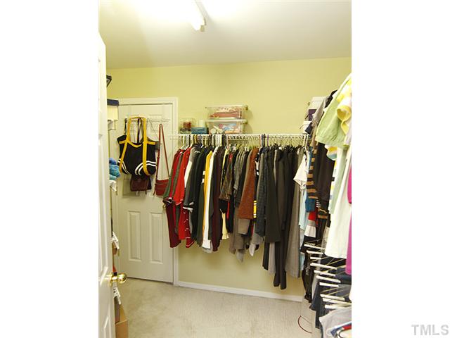 8512 Slabstone Court Raleigh, NC 27613 - Photo 14 of 21 a view of walk in closet with clothes