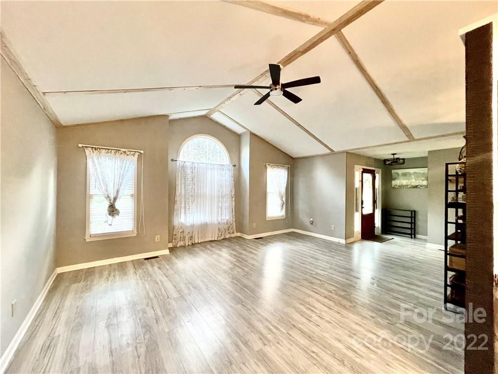 4346 River Road Hickory, NC 28602 - Photo 4 of 18 a view of empty room with wooden floor and fan