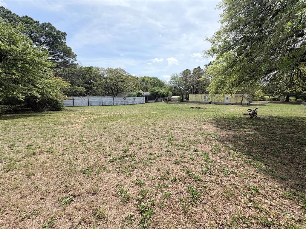 6295 Rendon New Hope Road Fort Worth, TX 76140 - Photo 1 of 38 View of yard featuring view of wooded area