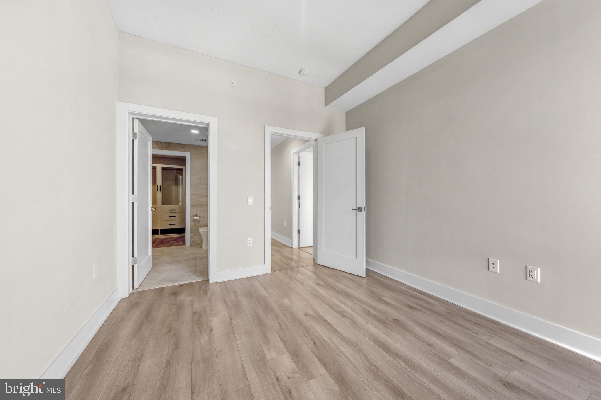 88 V Street Southwest, Unit 808 Washington, DC 20024 - Photo 22 of 47 wooden floor in an empty room