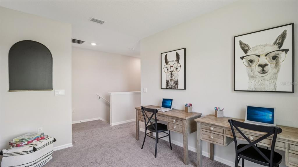 32516 Welling Blade Loop Wesley Chapel, FL 33545 - Photo 17 of 39 a view of a workspace with furniture