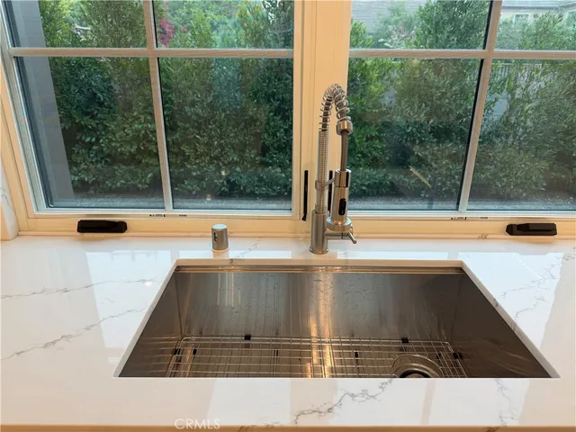 a view of a bathroom with a tub and window