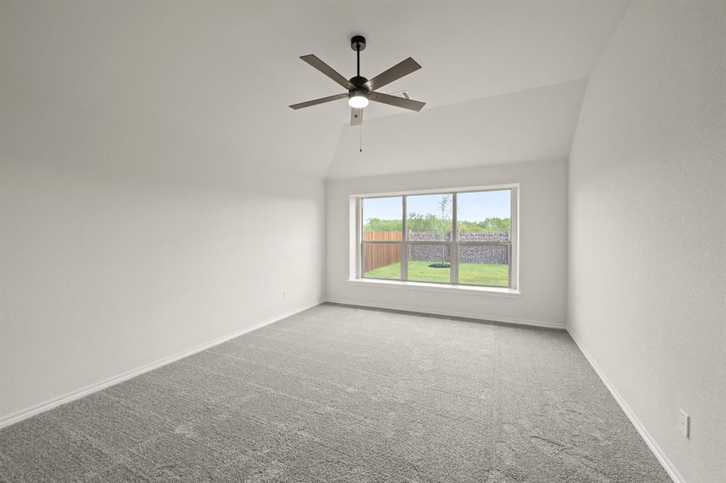 10809 Rothland Street Crowley, TX 76036 - Photo 21 of 30 an empty room with windows and ceiling fan