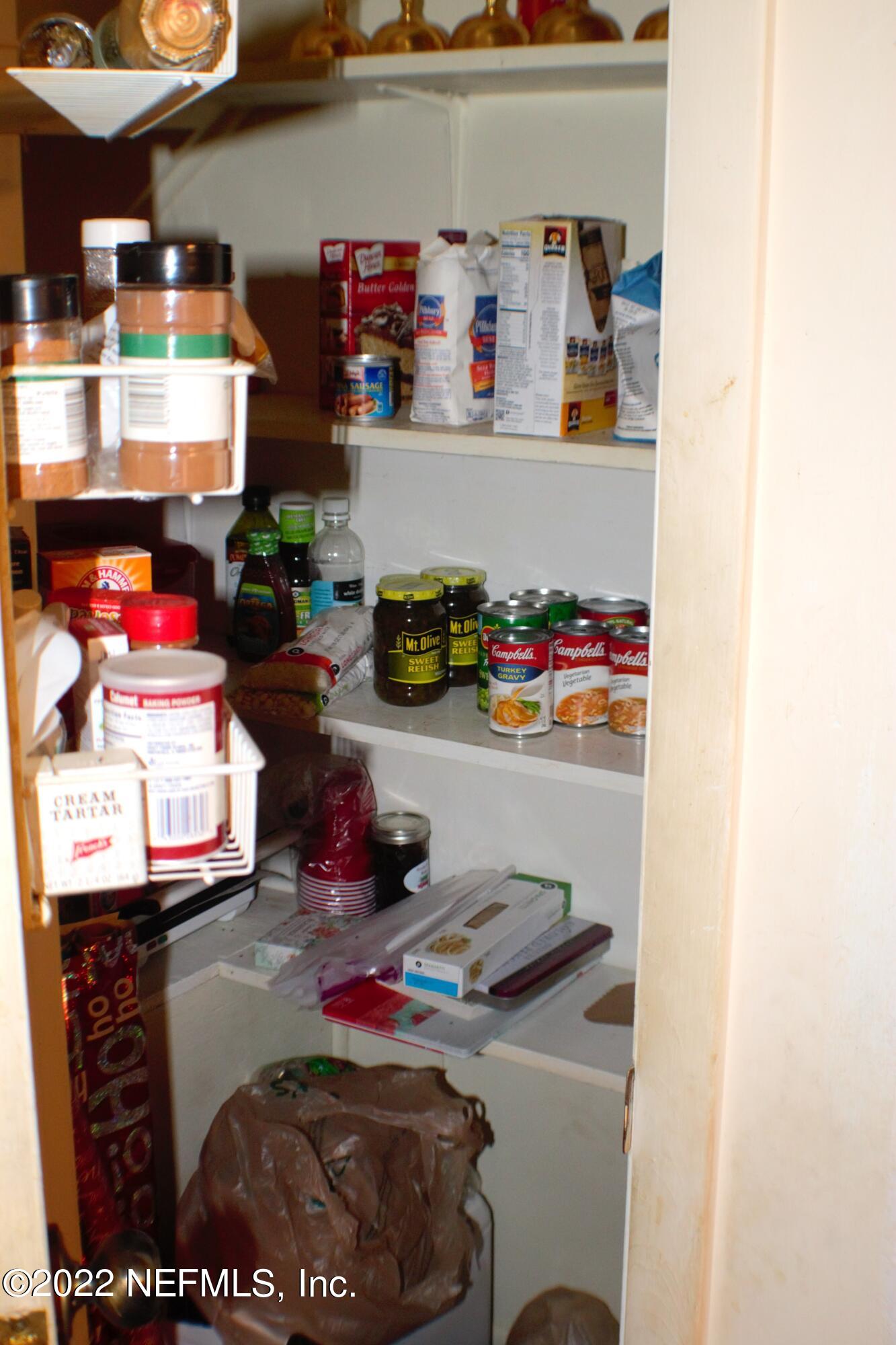 6060 Taylor Road Jacksonville, FL 32234 - Photo 9 of 27 a room with water heater and storage