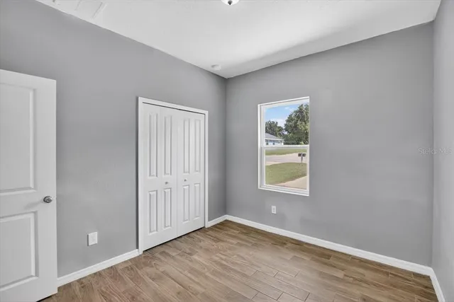 a view of room with window and closet