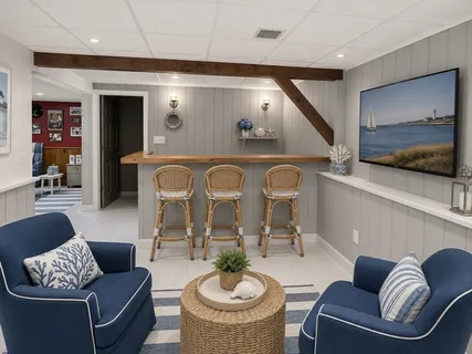 a living room with furniture and a view of kitchen