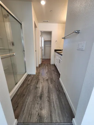 a view of a hallway view of wooden floor