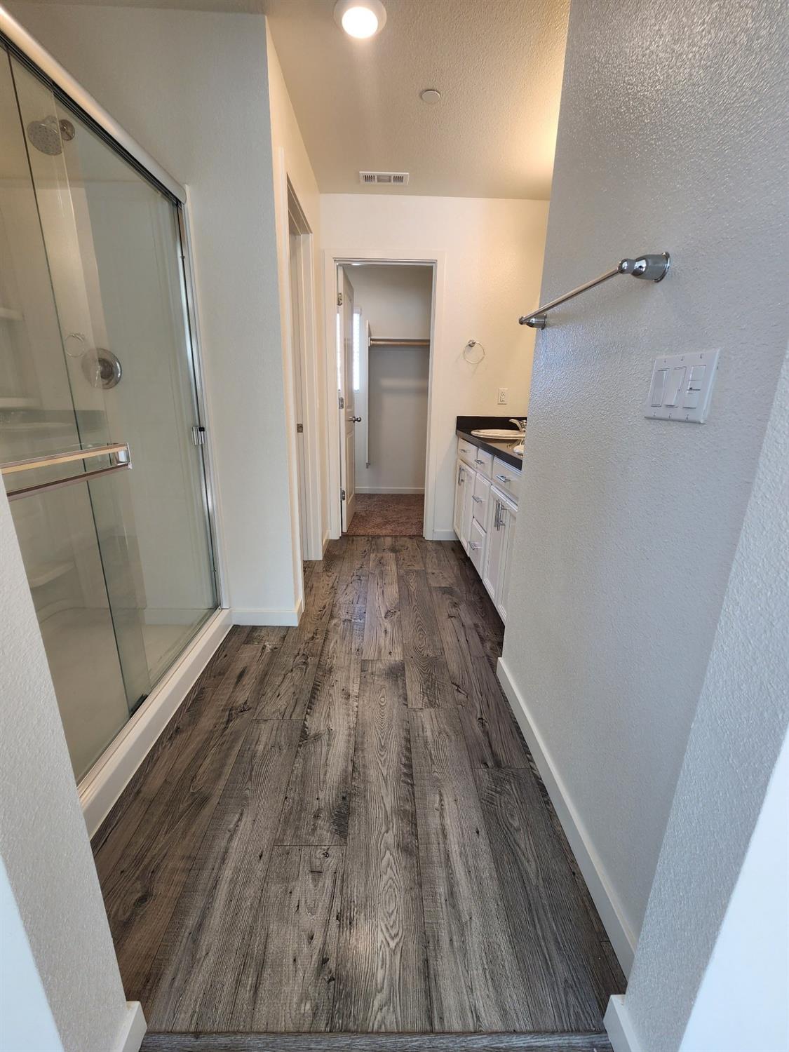 4384 Silver Cedar Lane Sacramento, CA 95834 - Photo 11 of 21 a view of a hallway view of wooden floor