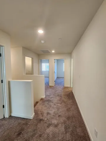 a large bathroom with a double vanity sink a mirror and a bathtub