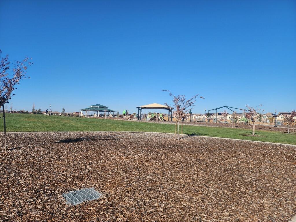 4384 Silver Cedar Lane Sacramento, CA 95834 - Photo 21 of 21 a view of a golf course with a lake