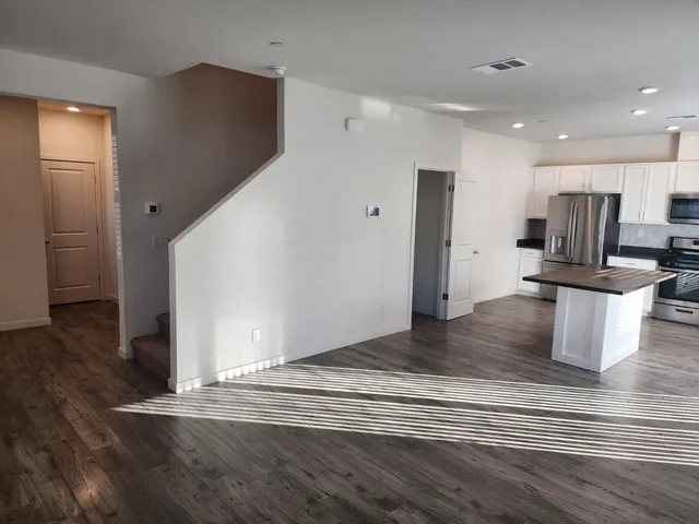 a view of a kitchen cabinets and wooden floor