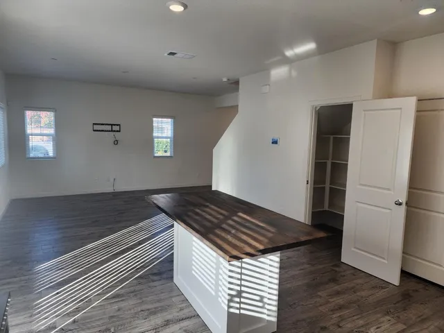 a kitchen with a sink and refrigerator