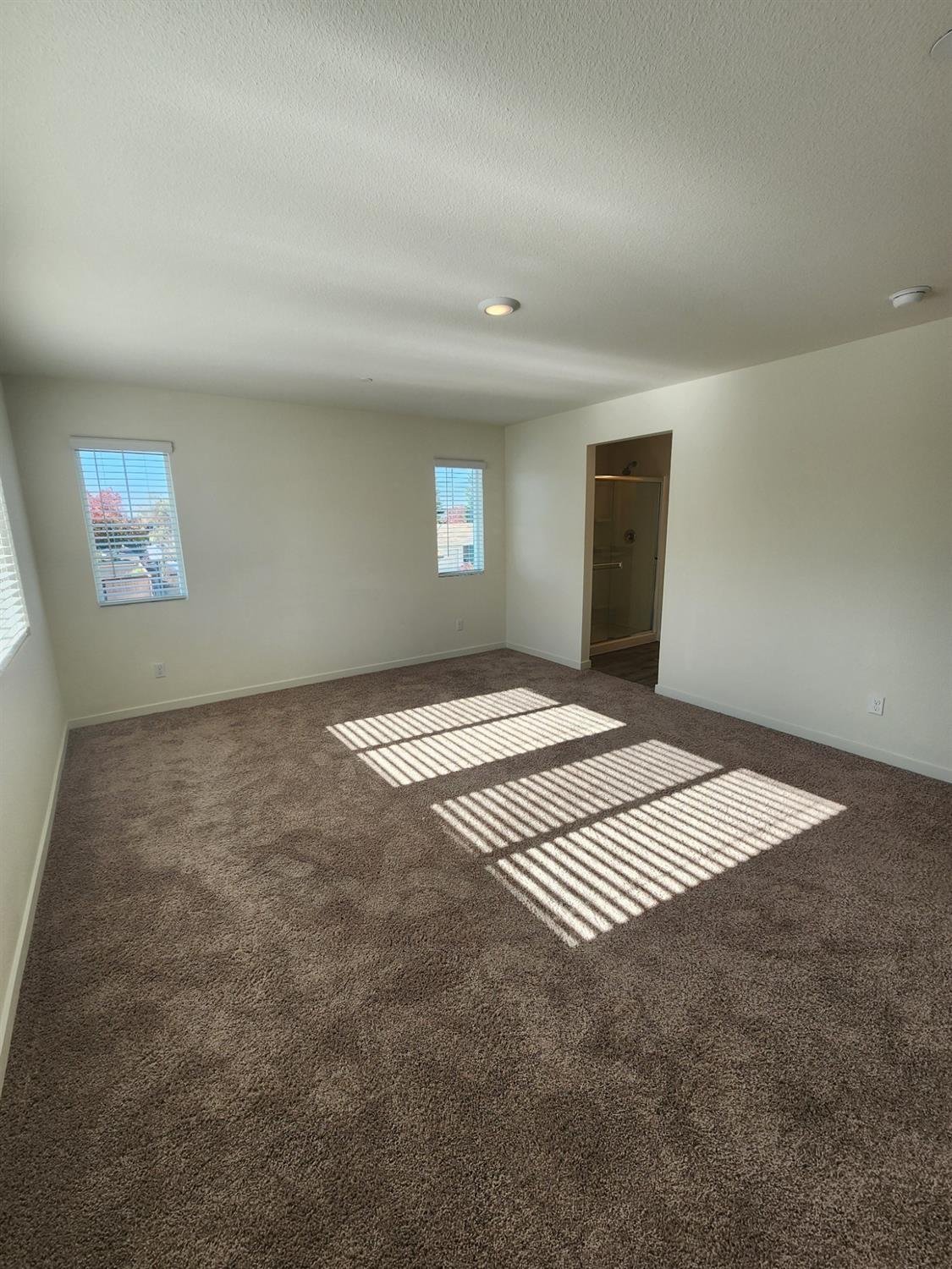 4384 Silver Cedar Lane Sacramento, CA 95834 - Photo 9 of 21 en empty room with windows