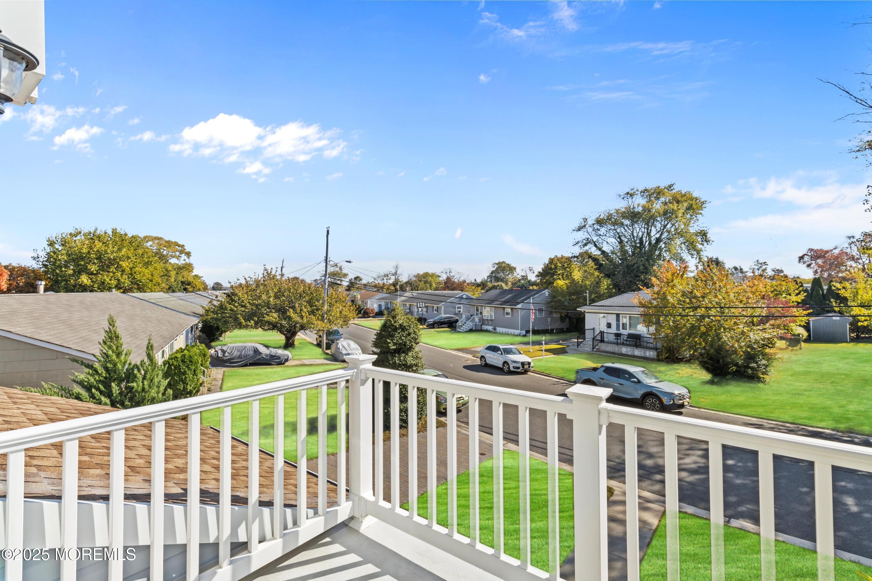 633 North Manetta Drive Point Pleasant, NJ 08742 - Photo 11 of 28 a view of a chairs and tables in the balcony