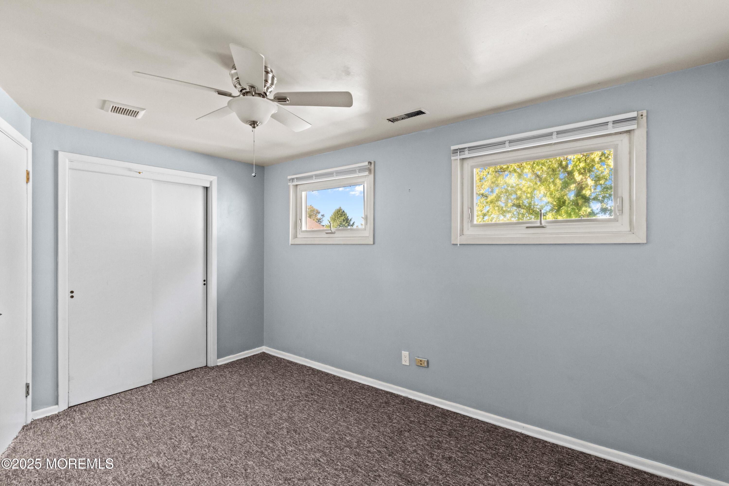 633 North Manetta Drive Point Pleasant, NJ 08742 - Photo 14 of 28 a view of room with window and ceiling fan