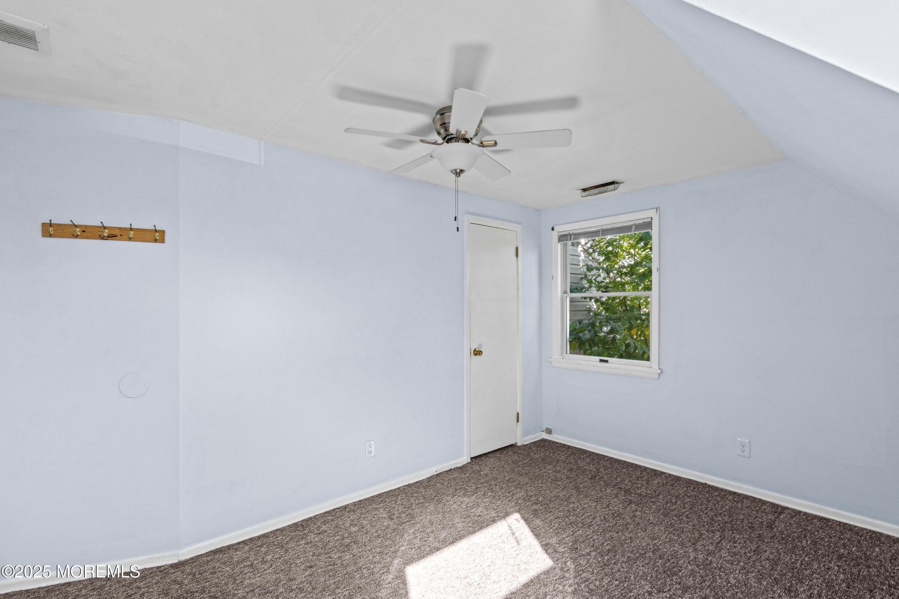 633 North Manetta Drive Point Pleasant, NJ 08742 - Photo 16 of 28 an empty room with a window and a ceiling fan