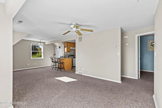 a view of livingroom with furniture and a window