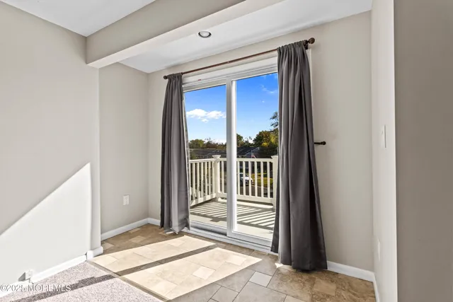 a view of a hallway with a outdoor space