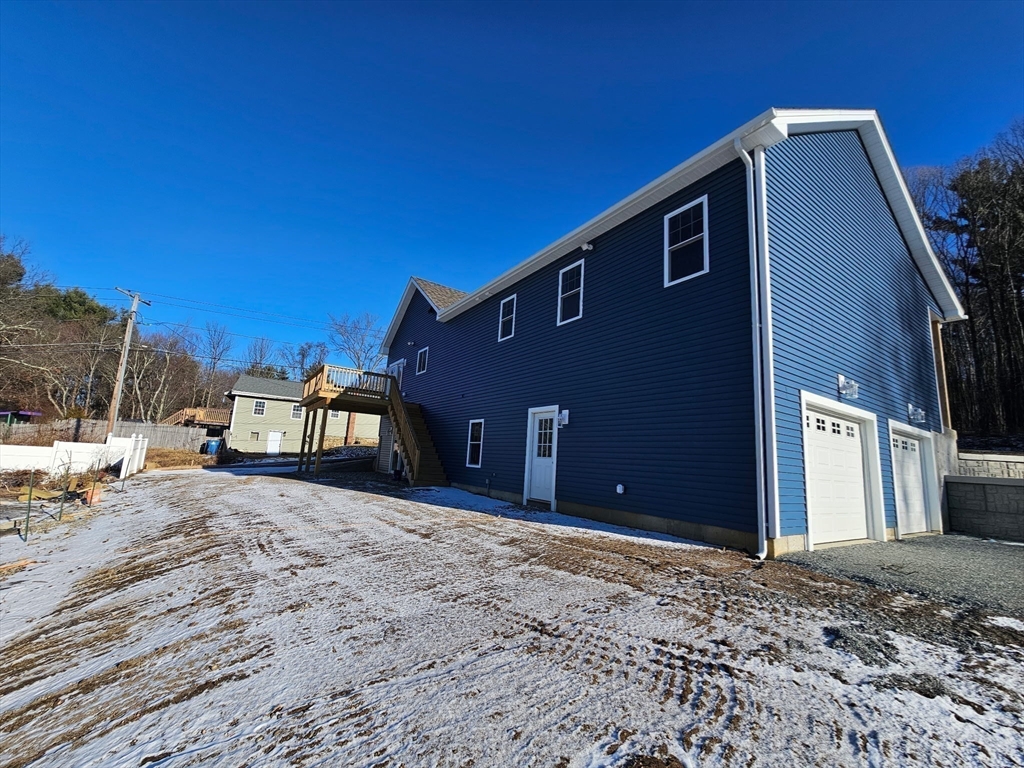 88 Stafford Holland Road Wales, MA 01081 - Photo 8 of 31 a view of a house with a snow in the yard