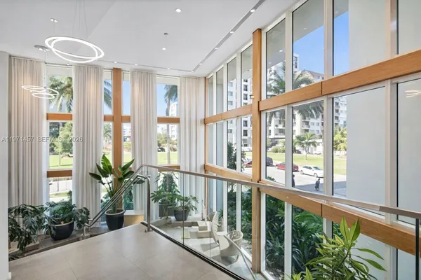 a view of an entryway with wooden floor and windows