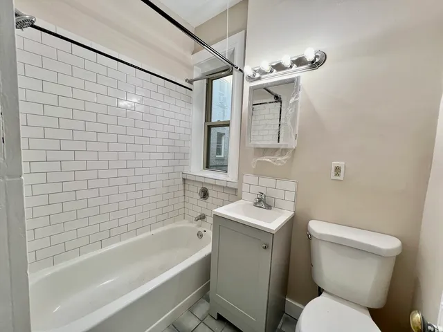 a bathroom with a toilet sink and bathtub