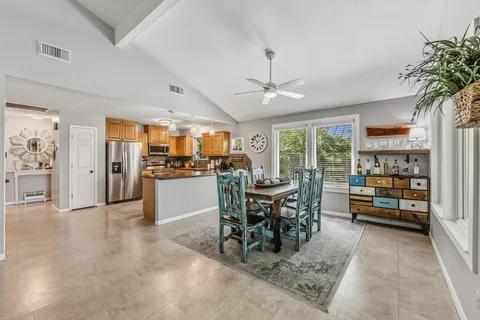a view of a dining room with furniture window and outside view
