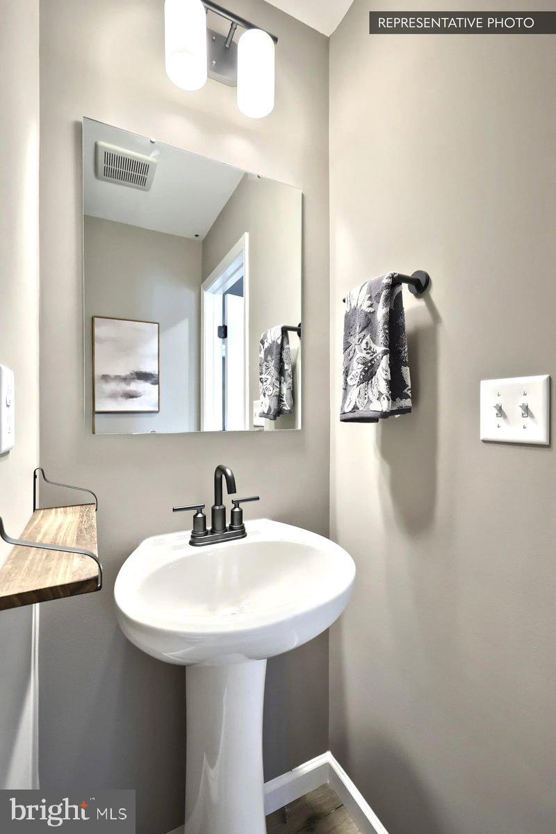 138 Redbud Road Bellefonte, PA 16823 - Photo 14 of 22 a bathroom with a sink and mirror