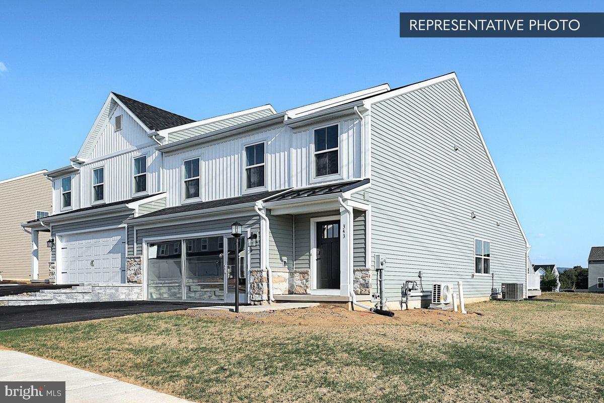 138 Redbud Road Bellefonte, PA 16823 - Photo 2 of 22 a front view of a house with garden