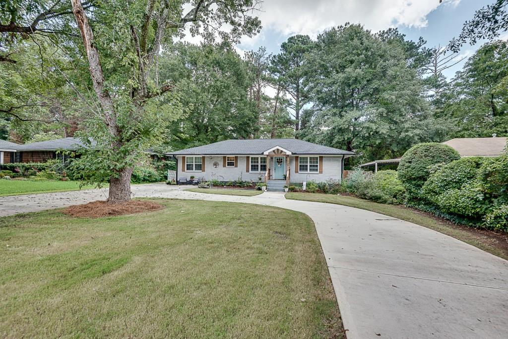 1708 Derrill Drive Decatur, GA 30032 - Photo 1 of 1 a front view of house with yard and green space