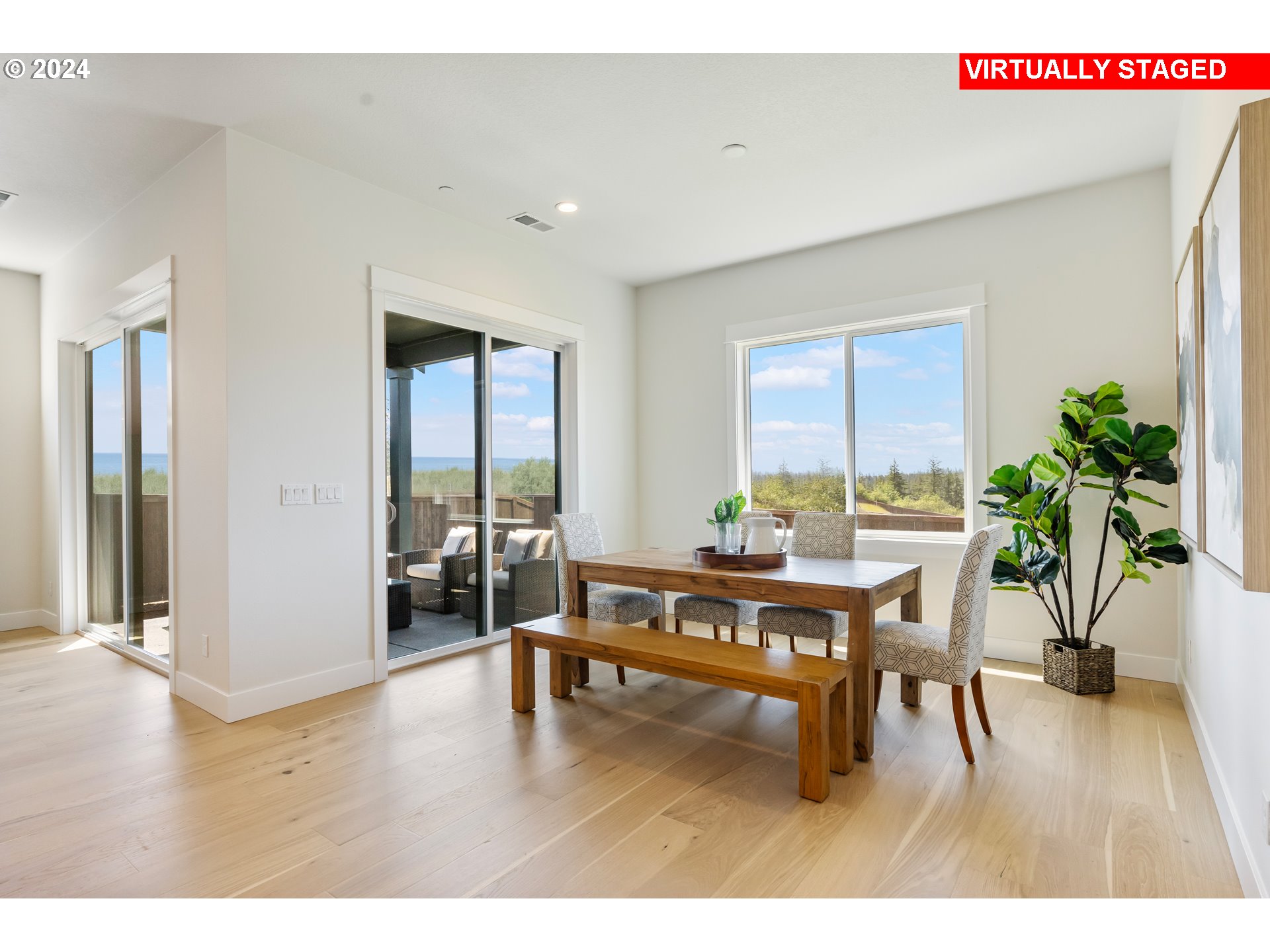 2784 North 49th Avenue Camas, WA 98607 - Photo 10 of 28 a living room with furniture a potted plant and a large window
