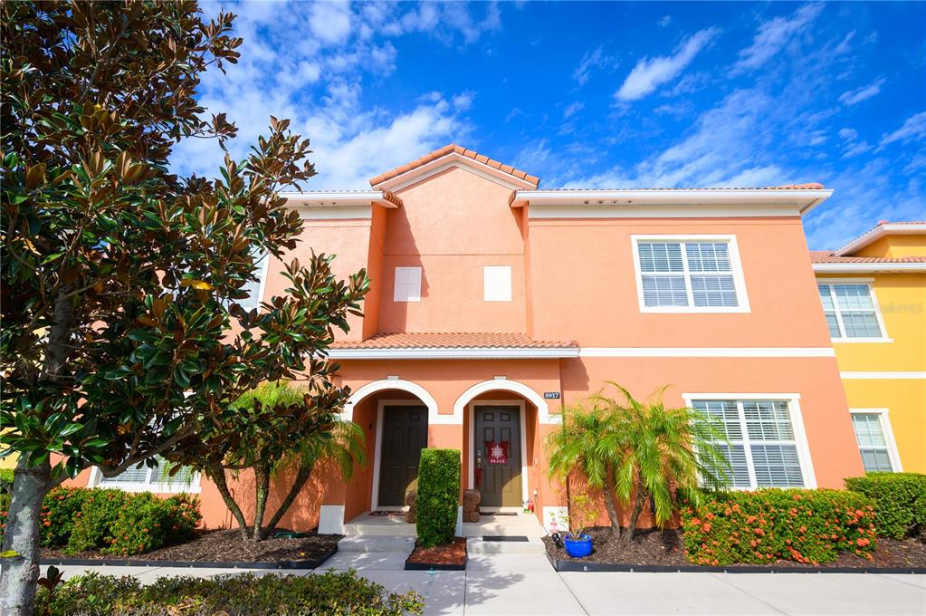 8917 Candy Palm Road Kissimmee, FL 34747 - Photo 1 of 1 a front view of a house with garden