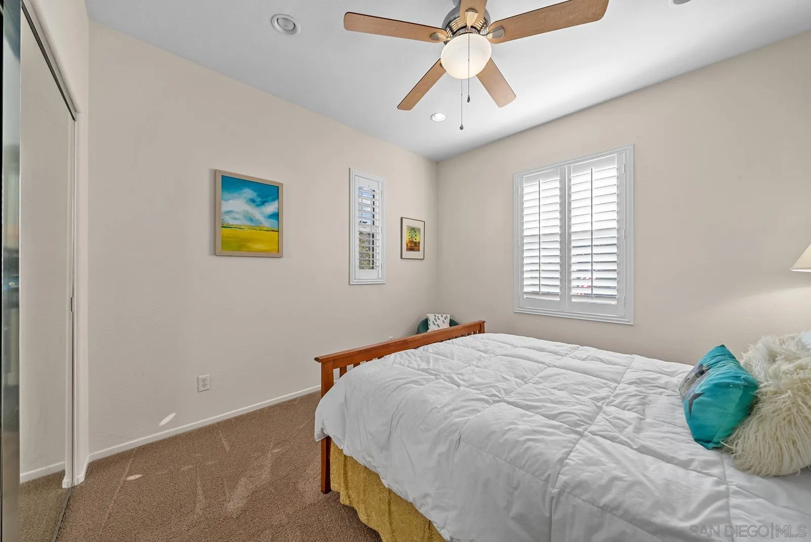 558 Beach Street Encinitas, CA 92024 - Photo 19 of 29 a bedroom with a bed and a chandelier