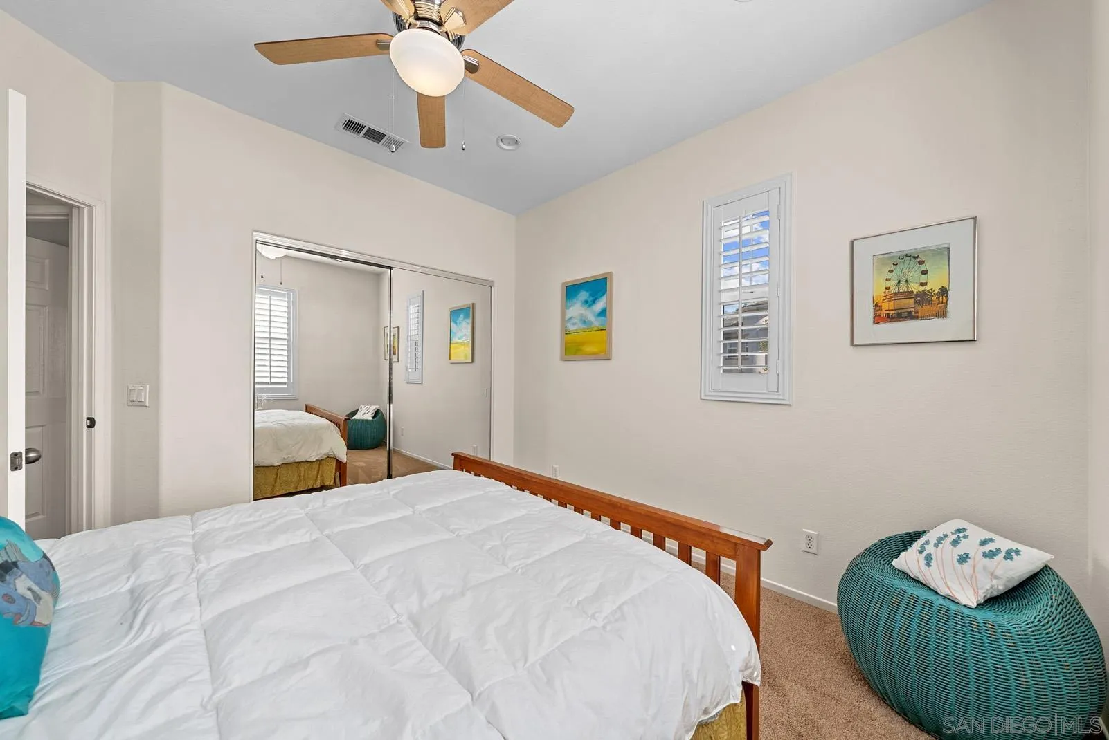 558 Beach Street Encinitas, CA 92024 - Photo 20 of 29 a bedroom with a bed and a chandelier