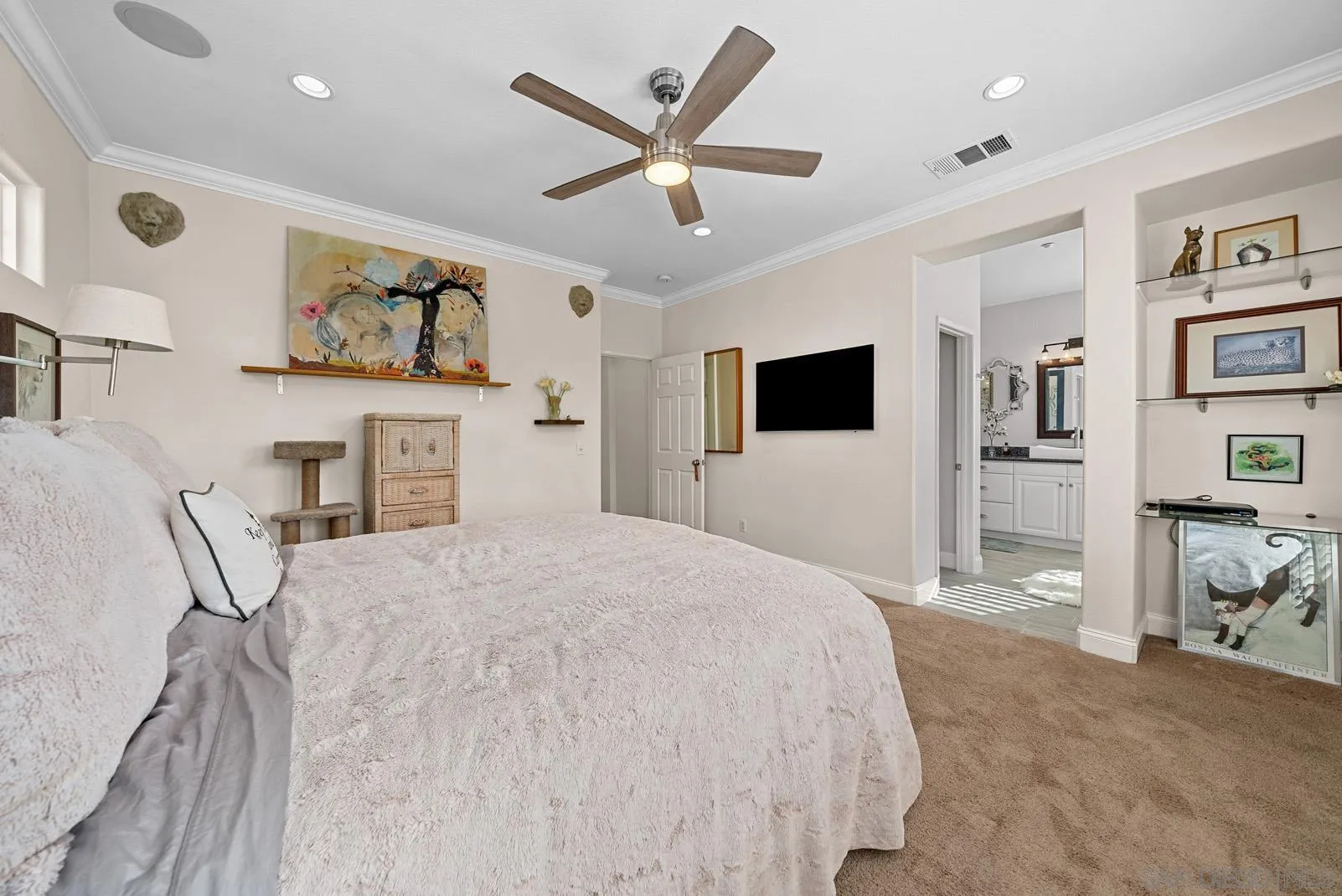 558 Beach Street Encinitas, CA 92024 - Photo 22 of 29 a spacious bedroom with a large bed and a flat screen tv