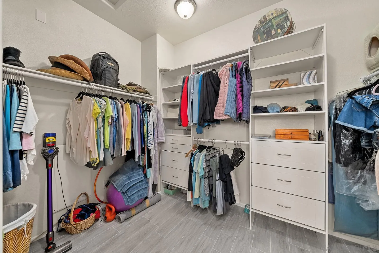 558 Beach Street Encinitas, CA 92024 - Photo 25 of 29 a view of walk in closet with clothes and shoes