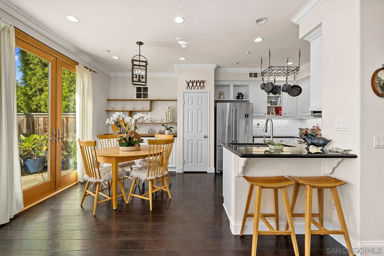 558 Beach Street Encinitas, CA 92024 - Photo 9 of 29 a view of a dining room with furniture and wooden floor