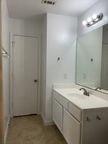 a bathroom with a sink and mirror