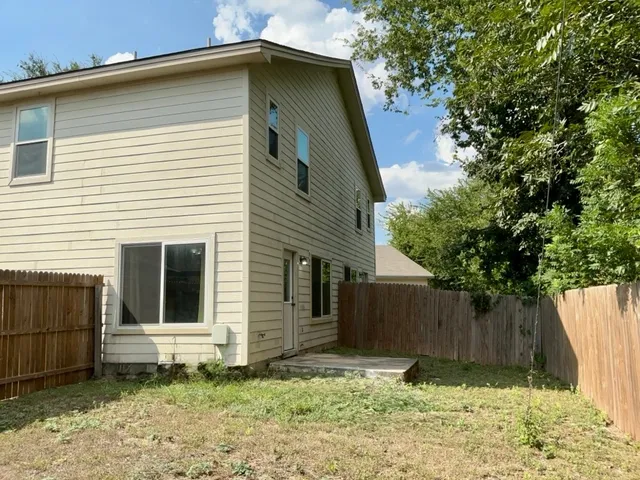 a house with a tree in front of it