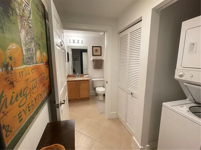 a bathroom with a sink toilet tub and shower
