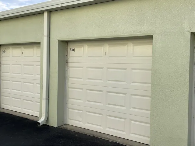 a view of swimming pool with outdoor seating and plants