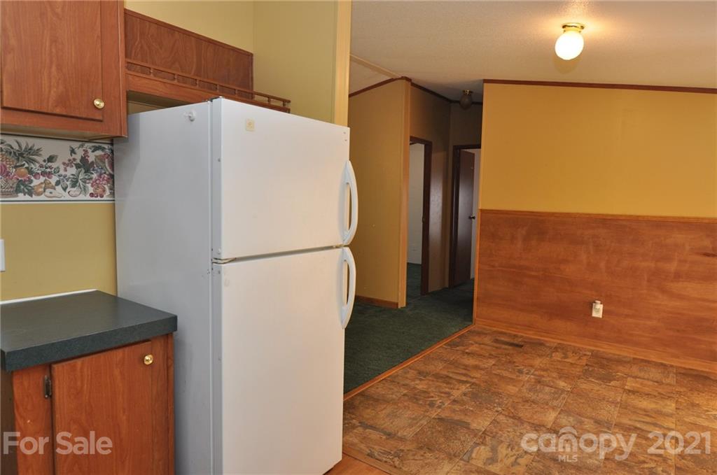 1210 Stringfellow Road Chester, SC 29706 - Photo 3 of 16 a white refrigerator freezer sitting in a kitchen