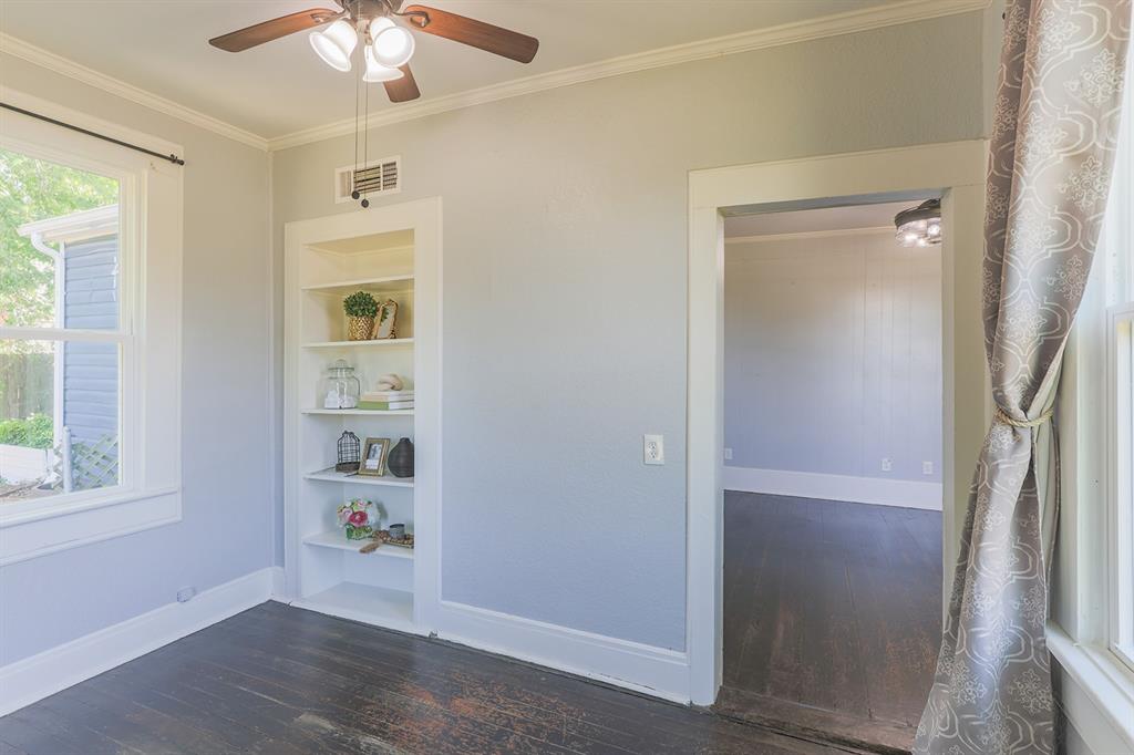453 East Marshall Street Van Alstyne, TX 75495 - Photo 11 of 30 wooden floor in an empty room with a window