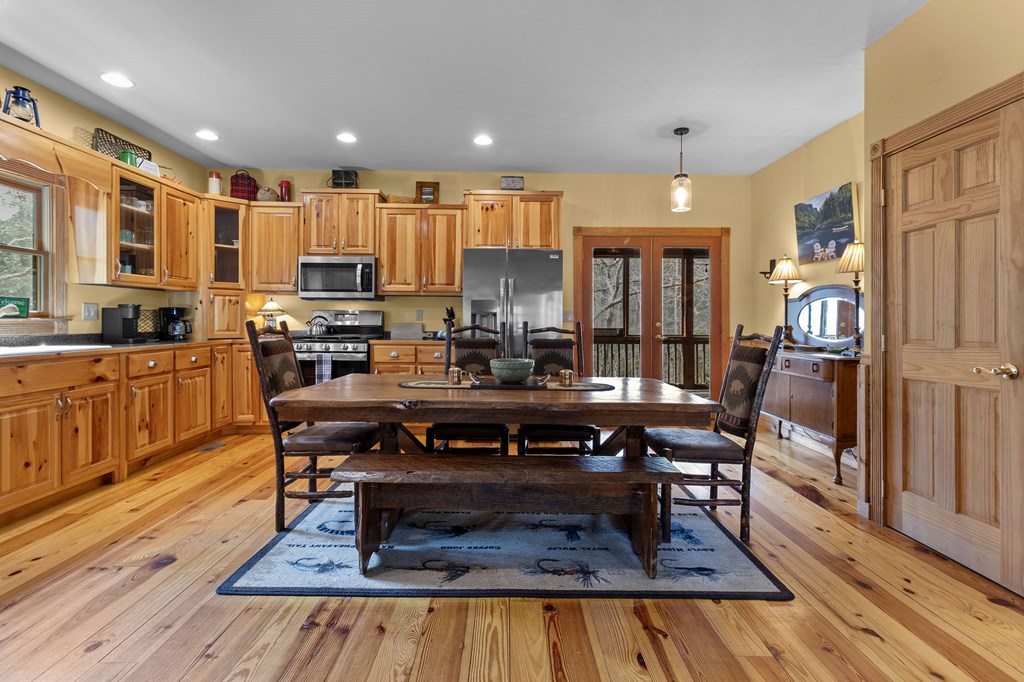 40 Graham Court Ellijay, GA 30540 - Photo 12 of 62 a living room with stainless steel appliances furniture wooden floor and a rug
